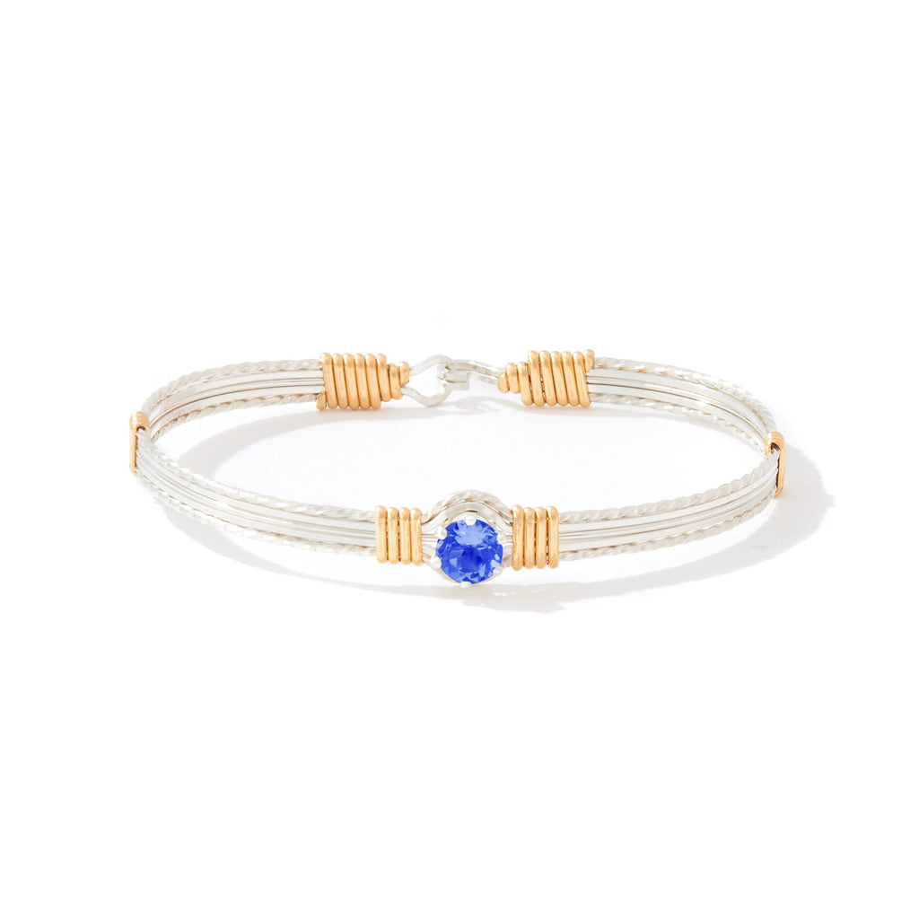 Ronaldo Jewelry Shining Star Bracelet in Sterling Silver with 14k Gold Artist Wire Wraps with the Sapphire Stone